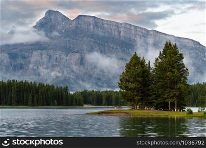 Panoramic image of Mount Rundle and Two Jack Lake with early morning mood, Banff National Park, Alberta, Canada