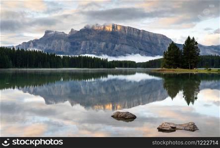 Panoramic image of Mount Rundle reflecting in Two Jack Lake with early morning mood, Banff National Park, Alberta, Canada