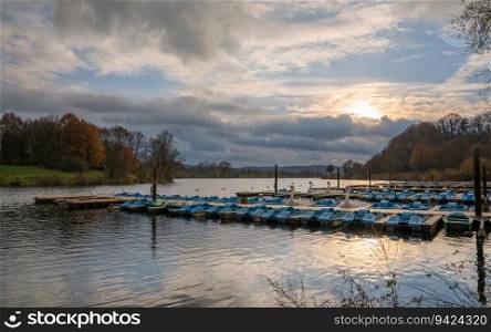 Panoramic image of paddleboats, autumn at the Kemnader lake, North Rhine Westphalia, Germany