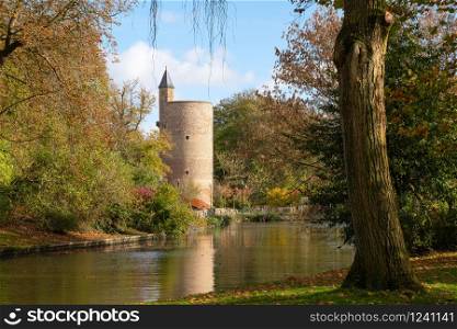 Panoramic image of the Minnewaterpark in Bruges with historic buildings, trees and idyllic canals, Flanders, Belgium