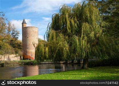 Panoramic image of the Minnewaterpark in Bruges with historic buildings, trees and idyllic canals, Flanders, Belgium