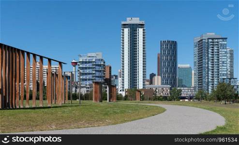 Panoramic image of the skyline of Calgary on a sunny day with blue sky, Alberta, Canada