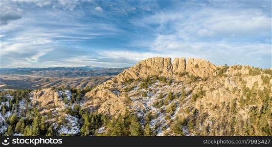 panoramic landscape of Horsetooth Rock, a landmark of Fort Collins, Colorado, winter scenery with some snow
