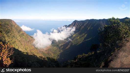 Panoramic low clouds start to form on Kalalau valley in Kauai Na Pali Coast