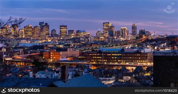 Panoramic of Boston Cityscape with highway trail to Boston MA USA at night.