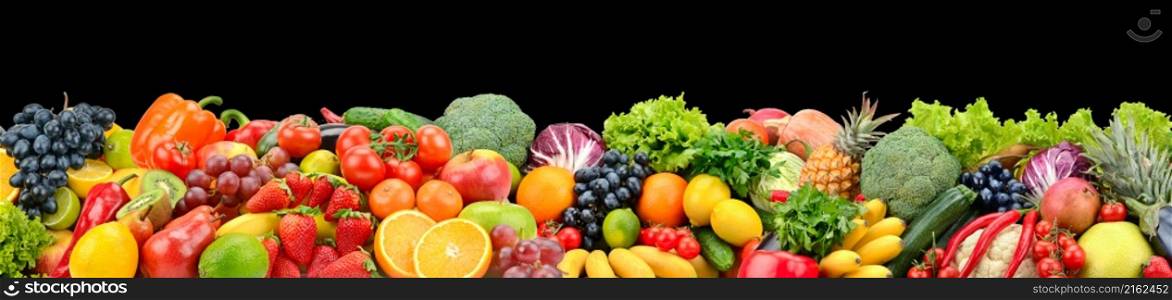 Panoramic photo fruits and vegetables isolated on black background.