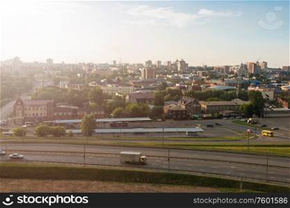 Panoramic picture of road and cars driving, summer sunny day in Barnaul, Siberia, Russia. Barnaul, Siberia, Russia