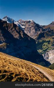 Panoramic scenery of Swiss alps mountain rage deep valley view from Eigergletscher, Jungfrau region - Switzerland