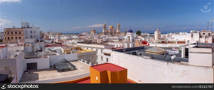 Panoramic shot of Cadiz and the building of the Cathedral of the Holy Cross. Spain. Andalusia.. Cathedral of the Holy Cross in Cadiz on a bright sunny day.
