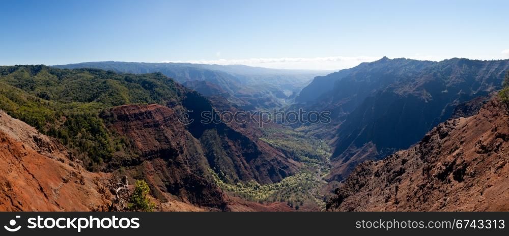 Panoramic shot of the steep rock sides of Waimea Canyone on Kauai