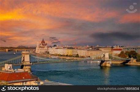 Panoramic sunset view with Chain bridge on river Danube in Budapest parliament building capital of Hungary. Panoramic sunset view with Chain bridge of Budapest parliament building capital of Hungary