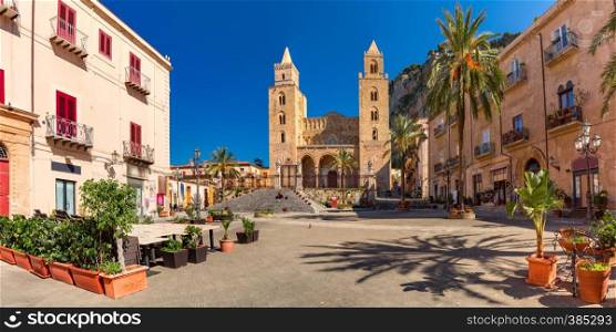 Panoramic vew of Cathedral-Basilica of Cefalu or Duomo di Cefalu and square Piazza del Duomo in the old town of coastal city Cefalu, Sicily, Italy. Cefalu at sunset, Sicily, Italy