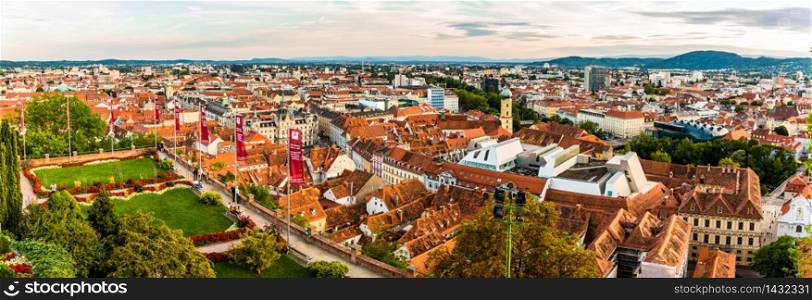Panoramic view at Graz city with his famous buildings. River mur, clock tower, art museum, town hall. Famous tourist destination in Austria. Panoramic view at Graz city with his famous buildings. Famous tourist destination in Austria