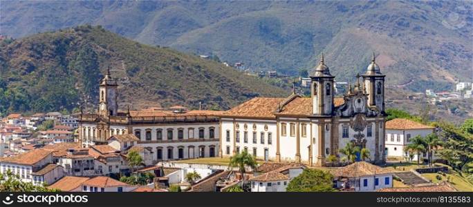 Panoramic view from the top of the historic center of Ouro Preto with its houses, church, monuments and mountains. Panoramic view from the top of the historic center of Ouro Preto