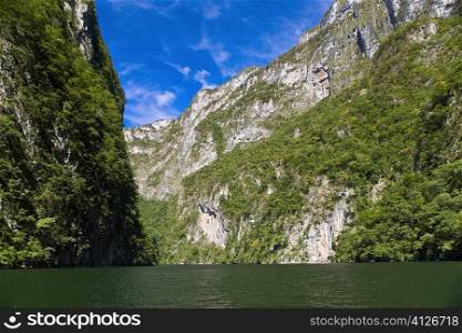 Panoramic view of a lake with a mountain range in the background, Sumidero Canyon, Chiapas, Mexico