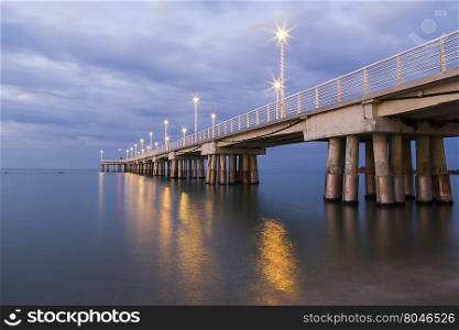 Panoramic view of a pier decorated with Christmas lights