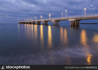 Panoramic view of a pier decorated with Christmas lights