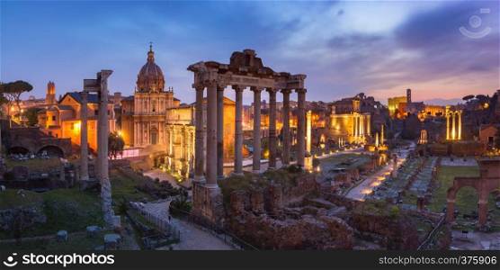 Panoramic view of ancient ruins of a Roman Forum or Foro Romano at sunsrise in Rome, Italy. View from Capitoline Hill. Ancient ruins of Roman Forum at sunrise, Rome, Italy