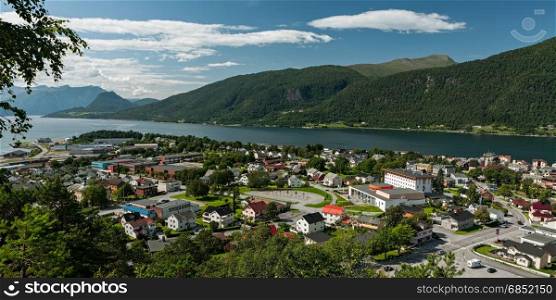 Panoramic view of Andalsnes city in Norway in Romsdalsfjorden under a sunny sky. Panoramic view of Andalsnes city in Norway in Romsdalsfjorden