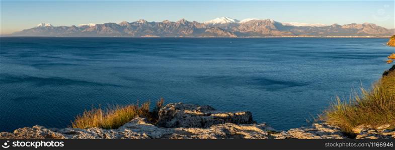 Panoramic view of Antalya on a sunny winter day with sea and snowy mountains. Antalya Panoramic View