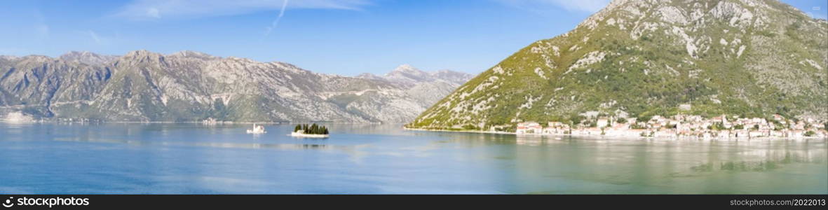 Panoramic view of Bay of Kotor from the sea surrounded by mountains in Montenegro, one of the most beautiful bay in the world.. Panoramic view of Bay of Kotor from the sea surrounded by mountains in Montenegro, one of the most beautiful bay in the world