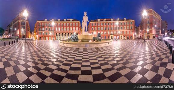 Panoramic view of Beautiful square Place Massena with the Fountain du Soleil at night Nice, French Riviera, Cote d'Azur, France. Place Massena in Nice, France
