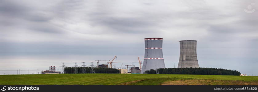 Panoramic view of building of Belarus Nuclear power plant. Nuclear power station in cloudy day with big chimneys. Cooling towers of atomic power plant