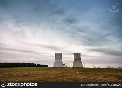 Panoramic view of building of Belarus Nuclear power plant. Nuclear power station in cloudy day with big chimneys. Cooling towers of atomic power plant
