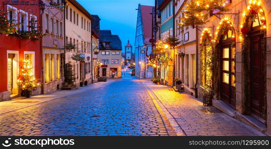 Panoramic view of Christmas street with gate and tower Plonlein in medieval Old Town of Rothenburg ob der Tauber, Bavaria, southern Germany. Christmas Rothenburg ob der Tauber, Germany