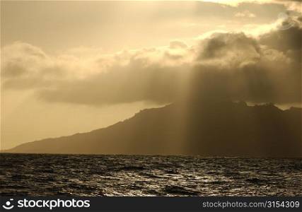 Panoramic view of clouds obscuring the sun over the sea, Moorea, Tahiti, French Polynesia, South Pacific