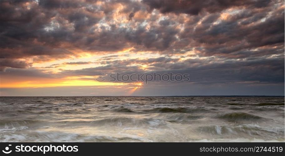 Panoramic view of cloudy sunset on Atlantic ocean