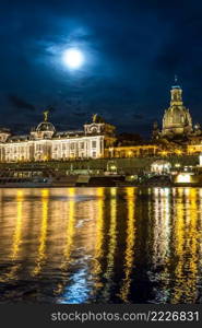 Panoramic view of Dresden in night and the river Elbe.