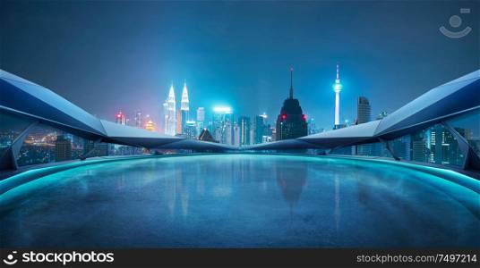 Panoramic view of futuristic geometric shapes design empty floor with Kuala Lumpur city skyline . Night scene .