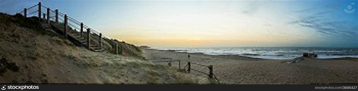 Panoramic view of Hengistbury Head from Southbourne at sunrise