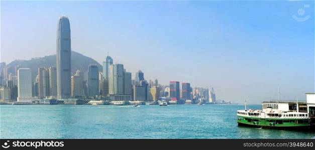 Panoramic view of Hong Kong island with ferry boat from Kowloon island
