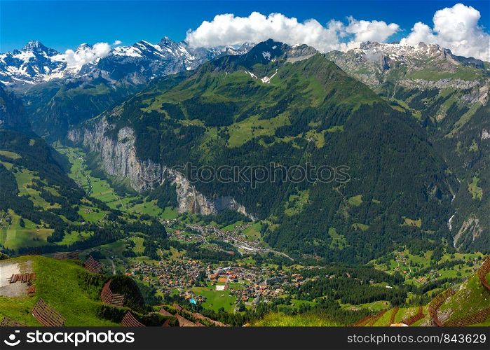 Panoramic view of Lauterbrunnen valley and Swiss Alps from the summit of mountain Mannlichen, Switzerland.. Mountain village Wengen, Switzerland