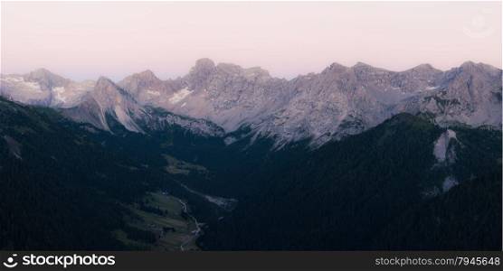 Panoramic view of Marmolada mountains ridge after sunset, Val di Fassa, Italian Dolomites