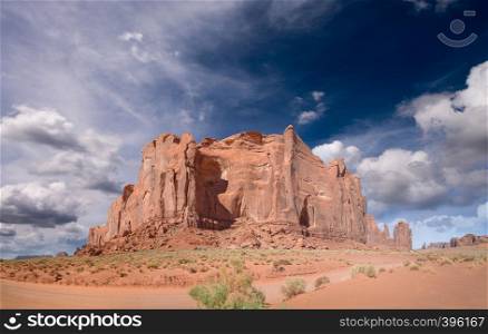 Panoramic view of Monument Valley mountain and road across national park.