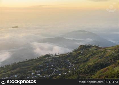 Panoramic view of mountain landscape with curve road at sunrise over sea of fog in Phetchabun, Thailand