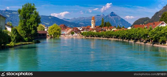 Panoramic view of Old City of Unterseen with Church and Aare river, Interlaken, important tourist center in the Bernese Highlands, Switzerland. Old City of Unterseen, Interlaken, Switzerland
