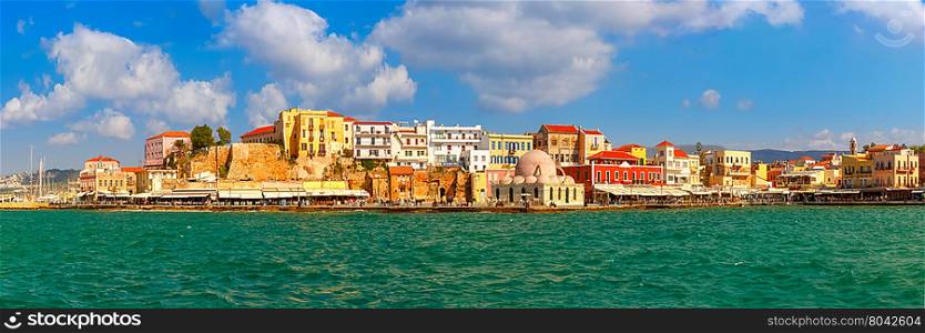 Panoramic view of old harbour of Chania with Venetian quay and Kucuk Hasan Pasha Mosque in the sunny morning, Crete, Greece