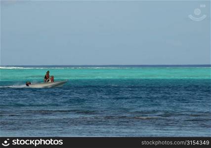 Panoramic view of people on a boat in the sea, Moorea, Tahiti, French Polynesia, South Pacific