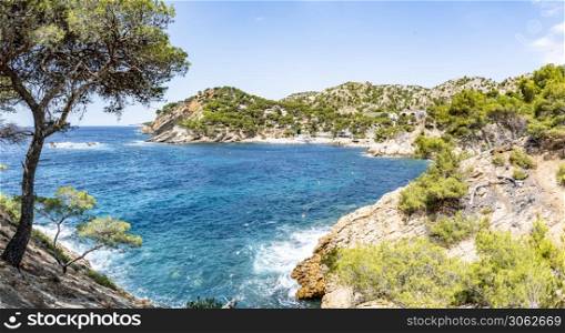 Panoramic view of Port and pebble beach of Calanque of Mejean in Ensues la Redonne, one of the creeks of Cote Bleue. South of France, Europe. Calanque of Mejean in Ensues la Redonne, South of France, Europe