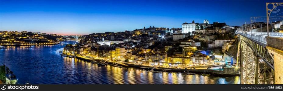 Panoramic view of Porto and the Dom Luiz bridge in Portugal at night