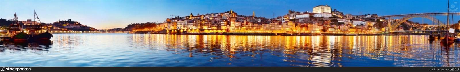 Panoramic view of Porto at twilight with reflection in Douro river. Portugal
