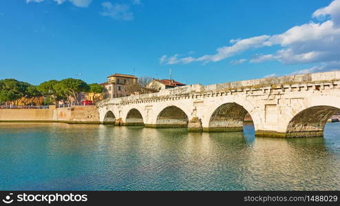 Panoramic view of Rimini with the Bridge of Tiberius, Italy