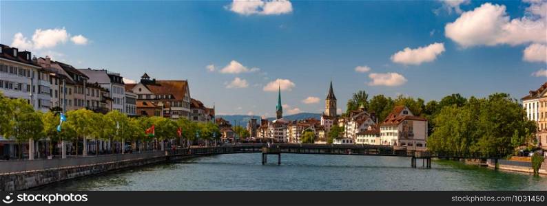 Panoramic view of river Limmat, Fraumunster and Church of St Peter in Old Town of Zurich, the largest city in Switzerland. Zurich, largest city in Switzerland