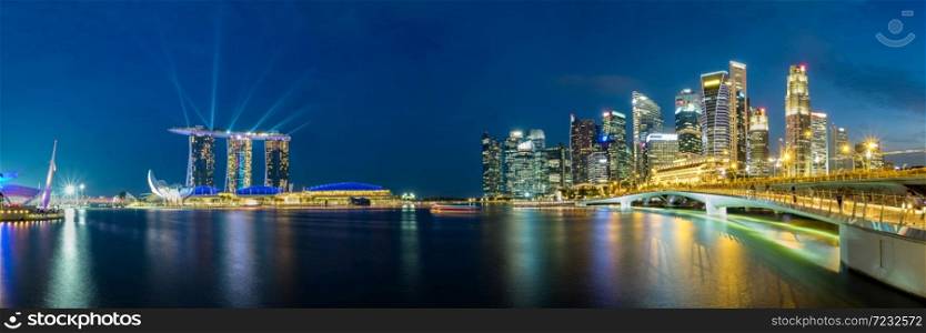 Panoramic view of Singapore business district skyline during laser show in the evening. . Panoramic view of Singapore business district skyline.