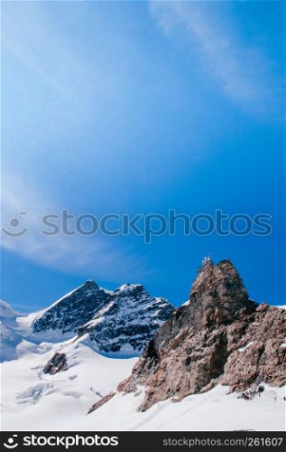 Panoramic view of Sphinx Observation deck tower on Jungfrau top of Europe, snow mountain peak of Switzerland