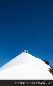 Panoramic view of Sphinx Observation deck tower on Jungfrau top of Europe, snow mountain peak of Switzerland